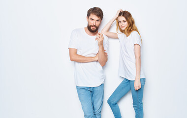 fashionable young couple in white t-shirts and jeans mockup design