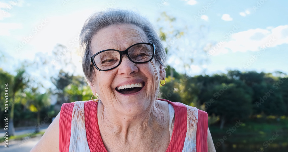 Smiling old Latin woman. Beautiful senior woman looking at the camera ...