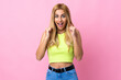 © luismolinero - Young Uruguayan blonde woman over isolated pink background celebrating a victory in winner position