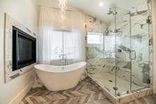 Modern Bathroom Interior With Marble Tiles And Chandelier