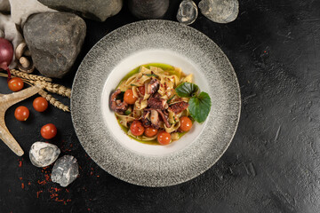 Wall Mural - Tagliatelle with octopus and cherry tomatoes