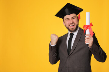 Wall Mural - Emotional student with graduation hat and diploma on yellow background. Space for text