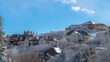 Pano Large houses on a snowy area with clear street roads and stop sign