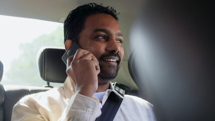 Sticker - transport, communication and business concept - indian male passenger or businessman calling on smartphone on back seat of taxi car