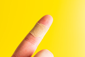 medical adhesive plaster. adhesive bandage plaster on yellow background
