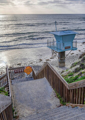 Canvas Print - Vertical Stairs and lifeguard tower with view of ocean and sky in San Diego California