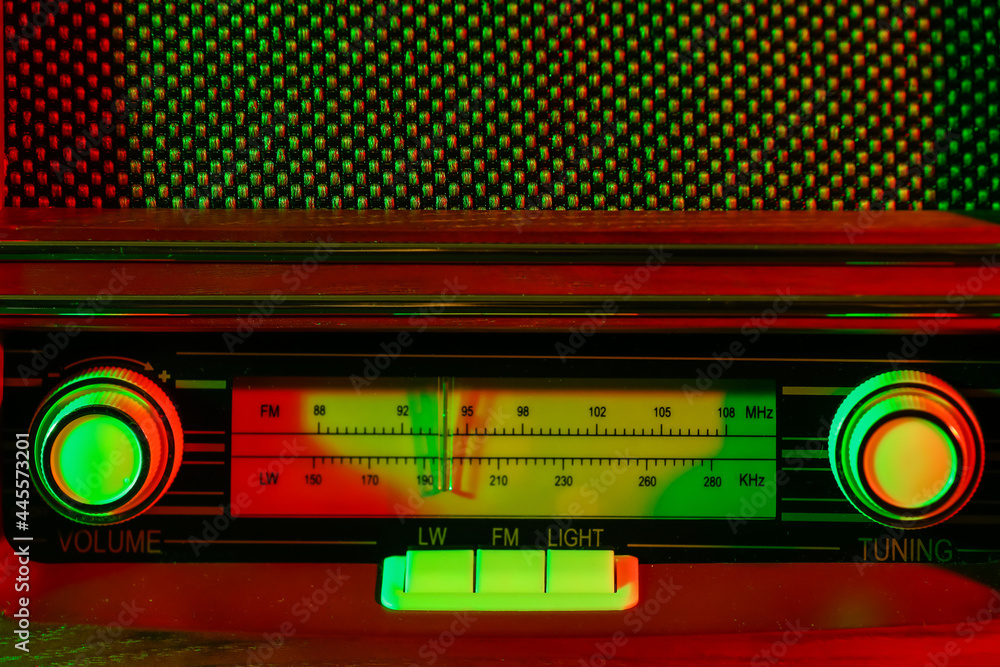 Retro radio receiver on dark color background, closeup