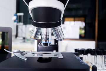 Cropped shot view of the equipment and science experiments in Laboratory, Chemical substances
for research and analyzing a sample under the microscope in laboratory.