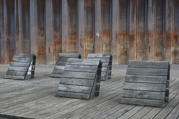 Dark brown wooden pallets on wooden planks