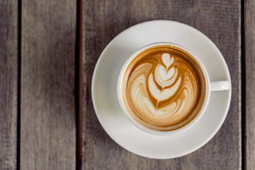 Latte art coffee in a white mug