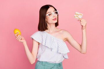 Wall Mural - Profile side photo of young girl happy positive smile look meds fresh natural lemon isolated over pink color background