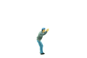 closeup shot of a small human figure toy on an isolated background