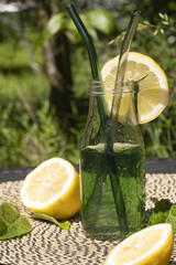 Sticker - Vertical shot of refreshing chlorophyll drink mixed with lemon and mint