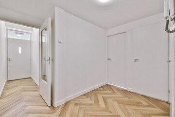 Sticker - Empty interior area with white walls and laminate flooring