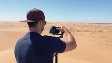 Filmmaker Filming In The Desert With Cinema Camera And Gimbal