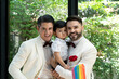 © godji10 - Couple gay carrying adopted child together in wedding day