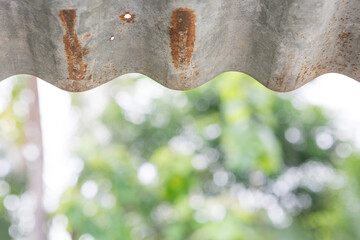 Wall Mural - Rusted zinc roof on natural bokeh  background