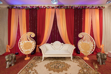 Wall Mural - Sofa in the room decorated for a traditional Hindu wedding ceremony