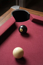 Cue And Eight Ball Lined Up Close On Pool Table Corner Pocket