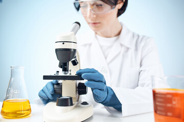 Woman in white coat science research experiment professional