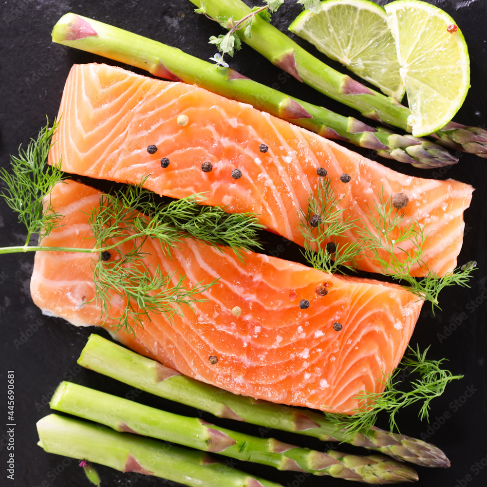 raw salmon fillet with asparagus - obrazy, fototapety, plakaty 