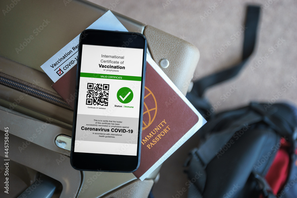 Disease immunity passport, Tourist uses of application on smartphone to show an international certification of vaccination at airport with Immunity passport and vaccination record card for covid-19 - obrazy, fototapety, plakaty 