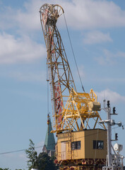 Giraffe painted pier crane in the harbor of Stockholm