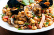 Fregula con frutti di mare, tipica pasta sarda condita con cozze, gamberi, calamari e vongole, Cucina Italiana di mare