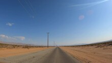 Driving Through A Desert Road