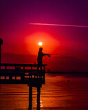 Fototapeta Sypialnia - fishing silhouette in sunrise over water