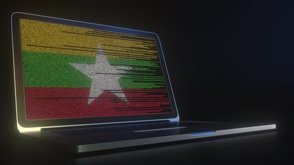 Open laptop and computer code on the screen composing flag of Myanmar. Modern information technology related 3d animation