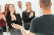 © yurolaitsalbert - speaker and a group of young people sitting in a conference room