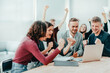 © yurolaitsalbert - happy team of employees looking at laptop screen