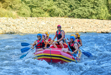 rafting on a large boat on a mountain river