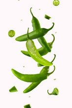 Jalapeno Pepper Levitation. White Background. Hot Spice, Seasoning. Levitation. Lots Of Facilities. Abstraction. Background. Texture. There Are No People In The Photo. Color Image.