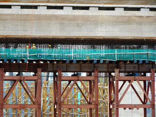 Sticker - PENANG, MALAYSIA -MAY 3, 2020: Structural work is underway at the construction site. Work is carried out in stages according to the sequence of work. The workers practice standard safety methods.