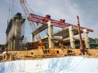 Sticker - PENANG, MALAYSIA -MAY 3, 2020: Structural work is underway at the construction site. Work is carried out in stages according to the sequence of work. The workers practice standard safety methods.