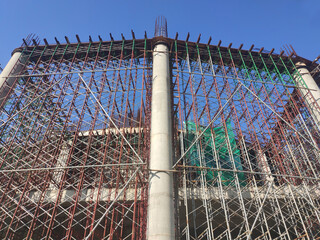 Sticker - PENANG, MALAYSIA -MAY 3, 2020: Structural work is underway at the construction site. Work is carried out in stages according to the sequence of work. The workers practice standard safety methods.