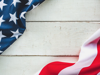 Wall Mural - American Flag lying on an empty table. Place for your inscription. Beautiful card. Closeup, view from above. National holiday concept. Congratulations for family, relatives, friends and colleagues