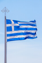 Greek Flag With Orthodox Cross On Blue Sky Background