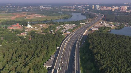 Wall Mural - panoramic view of the motorway junction and fast moving cars filmed from a drone 