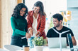 © nenetus - Confident business team talking with colleagues in the meeting on coworking space.