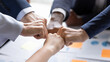 Diverse business team making group fist bump. Employees engaged in teamwork, keeping community spirit, expressing solidarity, trust, unity, friendship. Close up of multiethnic hands
