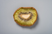 Dried Kiwi Fruit Slice On Grey Background