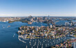 Stunning wide angle panoramic aerial drone view of the City of Sydney, Australia skyline with Harbour Bridge and Kirribilli suburb in foreground. Photo shot in May 2021, showing newest skyscrapers.