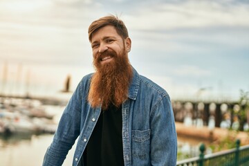 Sticker - Young irish hipster man smiling happy standing at the city.