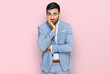 © Krakenimages.com - Young hispanic man wearing business jacket thinking looking tired and bored with depression problems with crossed arms.