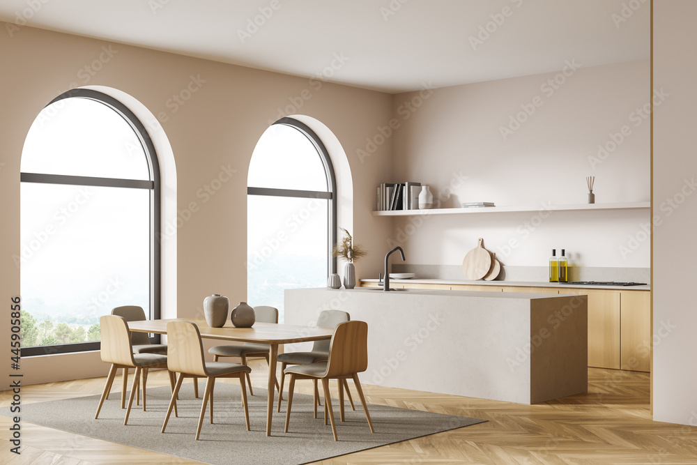 Corner view of the light double sided kitchen with arch windows, table - obrazy, fototapety, plakaty 
