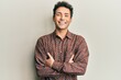 © Krakenimages.com - Handsome hispanic man wearing casual clothes happy face smiling with crossed arms looking at the camera. positive person.