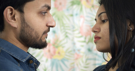 Wall Mural - Young Indian couple strictly looking at each other during a serious argument